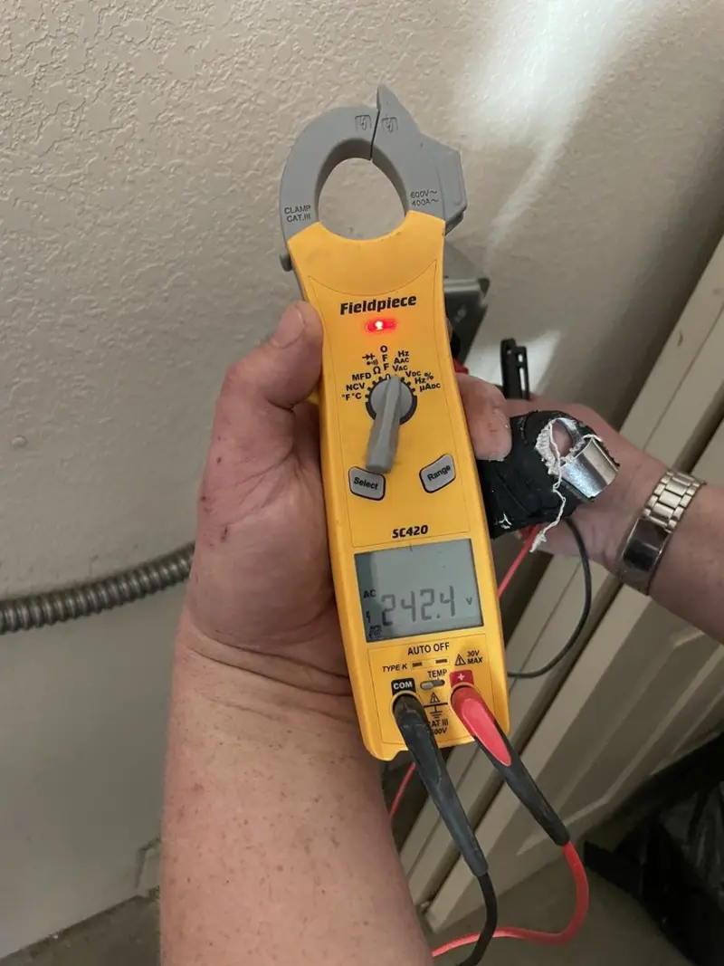 Voltage testing with clamp meter during Outlet Installation in North Logan